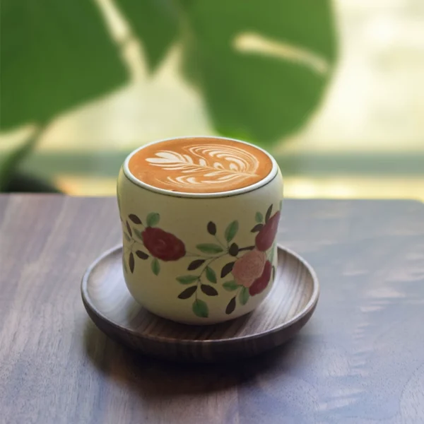 Handcrafted camellia ceramic coffee mug with gourd-shaped body, custom-made design, perfect for gifting.