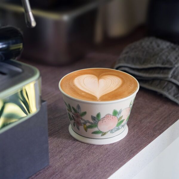 Custom hand-painted peach ceramic coffee cup, ideal for coffee machines, with a traditional design.