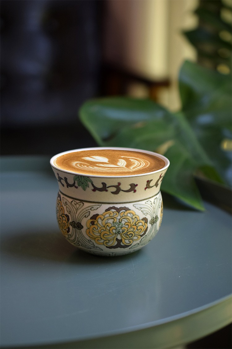 Hand-painted polychrome chrysanthemum ceramic coffee cup with a large belly shape, offering a comfortable grip and an elegant design for your coffee enjoyment
