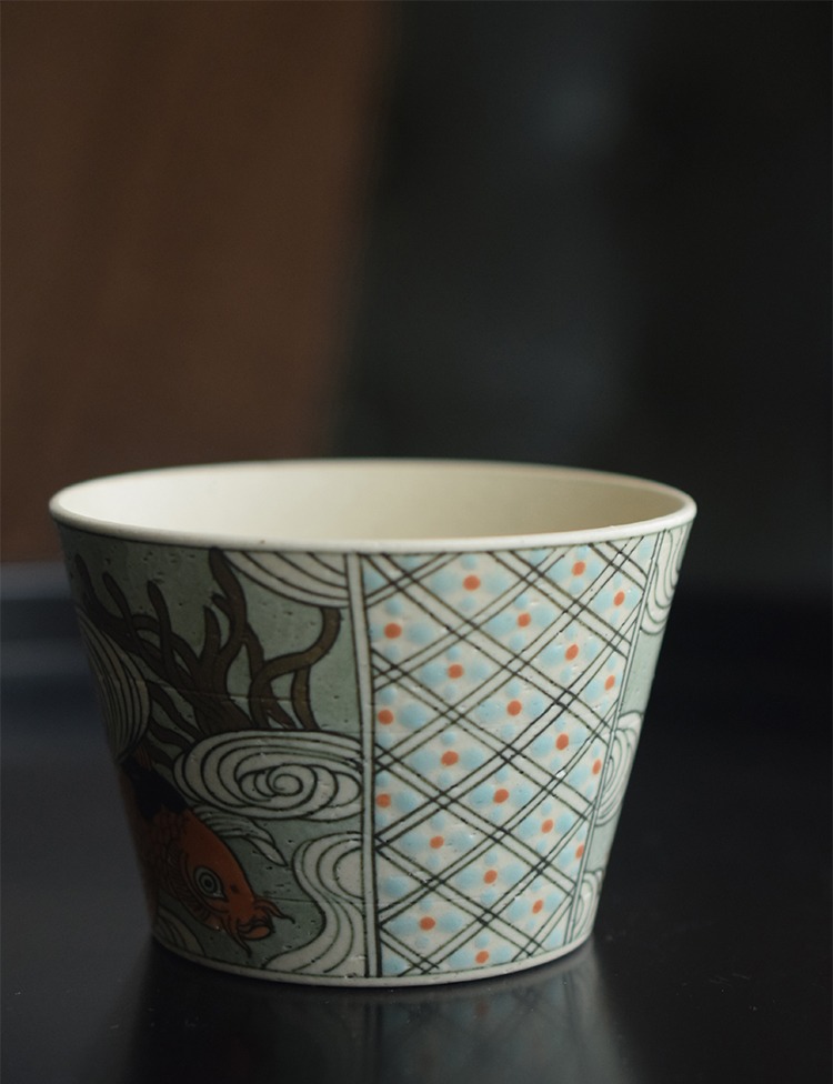 Handmade custom tea cup features hand-painted grid patterns—ideal for enhancing a serene teahouse atmosphere.