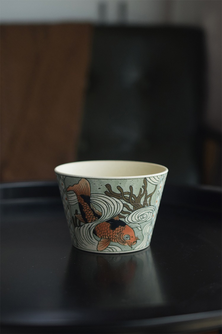 Vintage ceramic tea cup showcases blue-and-white craftsmanship, making it an ideal gift for tea enthusiasts.
