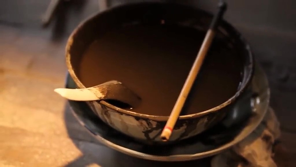 The process of combining various materials and pigments to create a glaze that will be applied to ceramic pieces