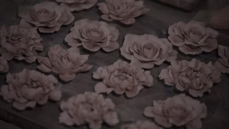 A decorative element made from porcelain, often handcrafted and molded into the shape of flowers
