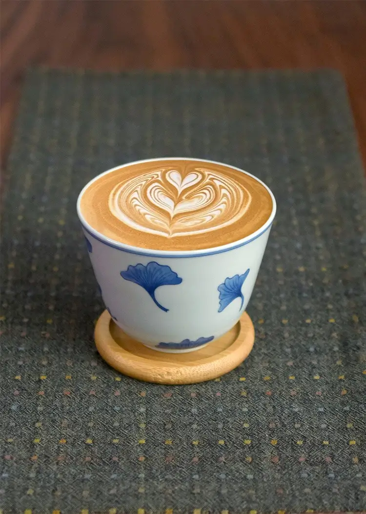 Blue and white ceramic cup with traditional Chinese motifs, a thoughtful gift for lovers of Chinese culture