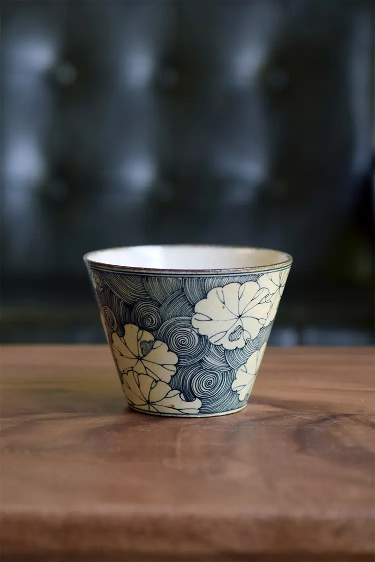 Blue and white porcelain coffee mug brings vintage Japanese charm to daily home drinkware moments.