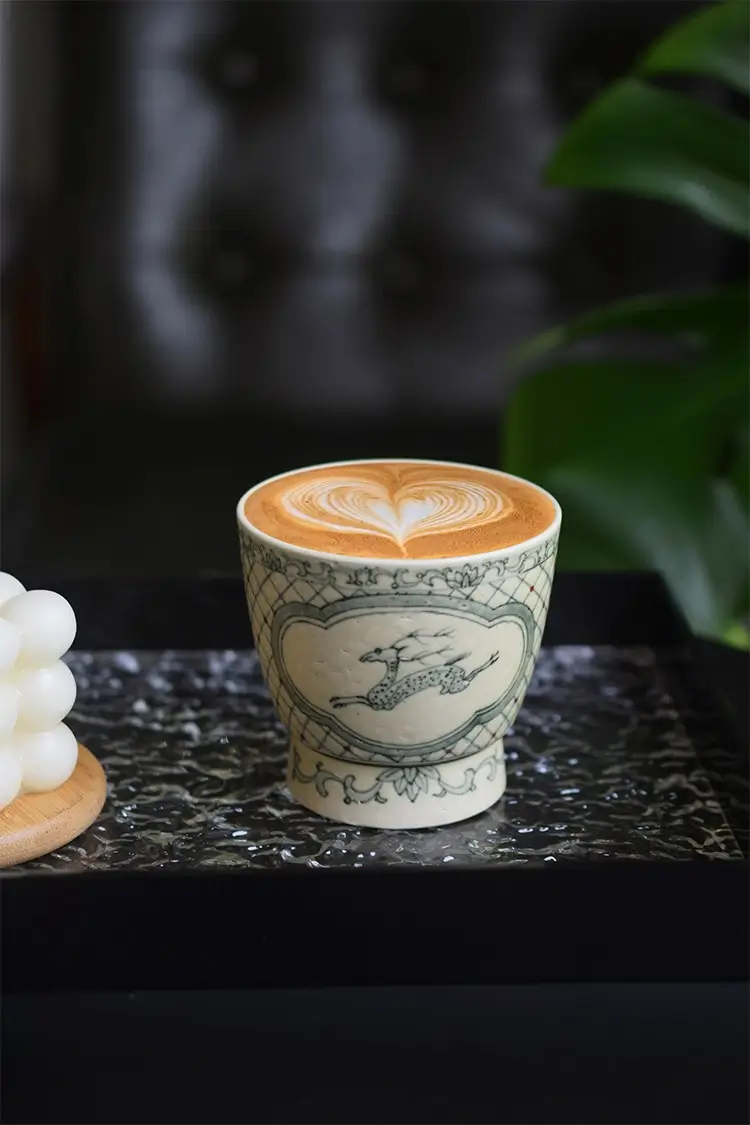 Blue and white porcelain coffee cup elevates vintage charm for cozy family gatherings
