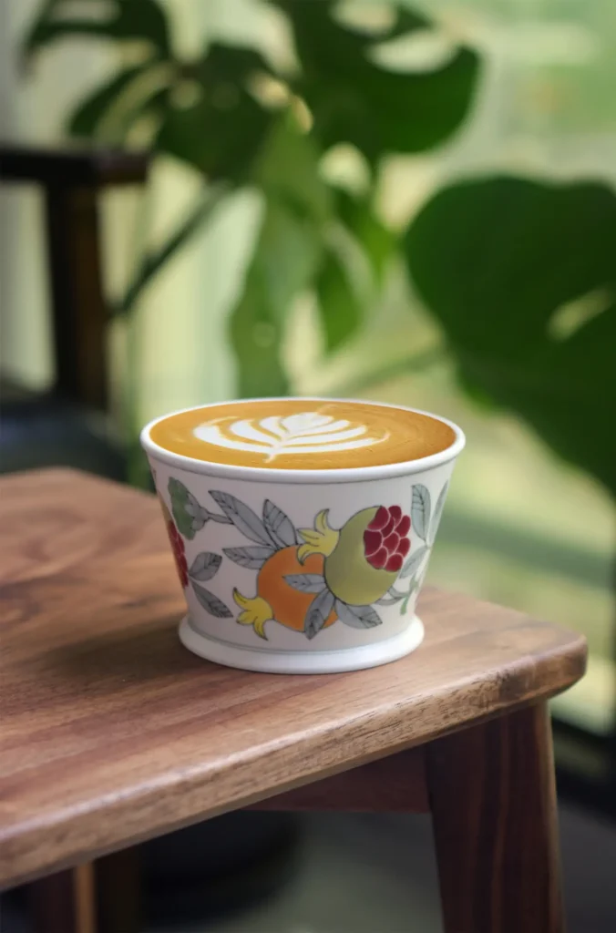 Ceramic coffee mugs with custom pomegranate theme make heartfelt handmade gifts for friends.