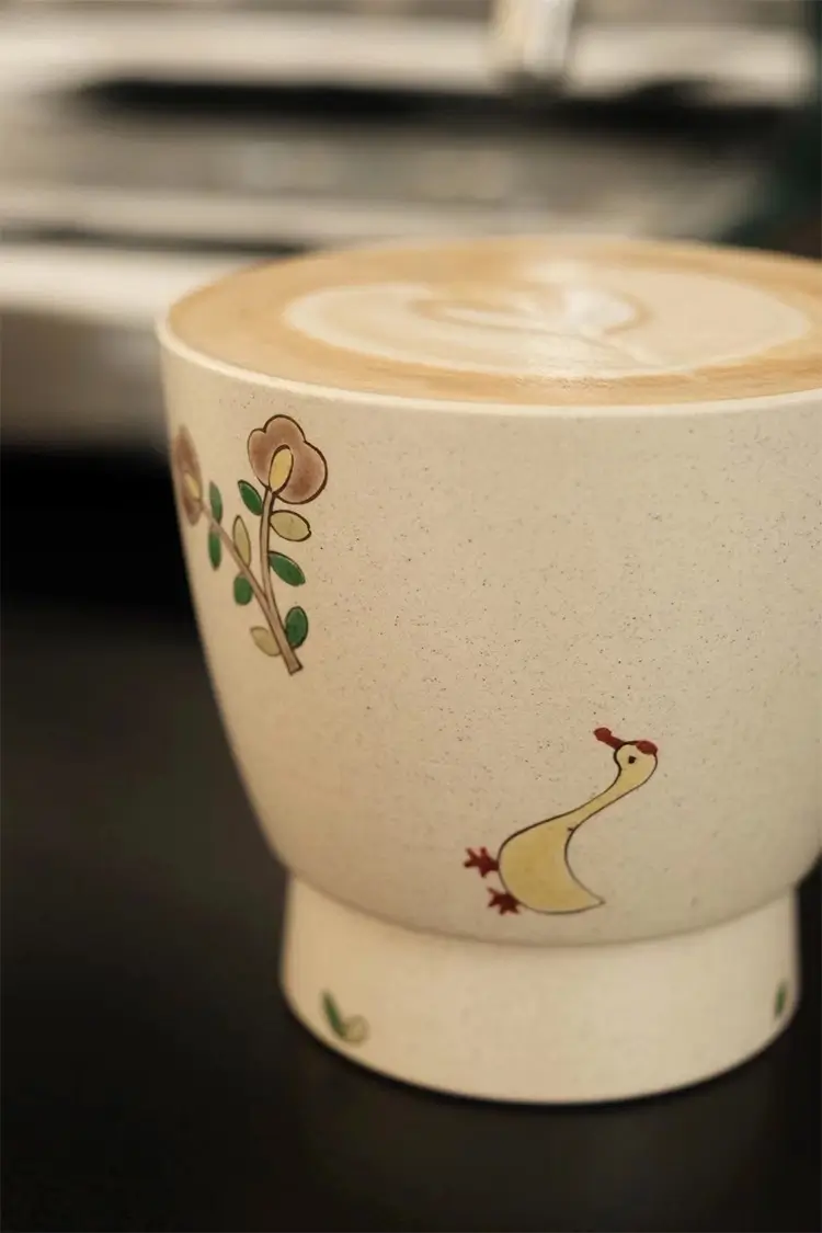 Custom ceramic mug with underglaze goose theme, adding elegance to daily coffee rituals.