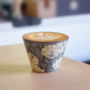 Customized traditional ceramic mugs featuring hand-painted blue-and-white lotus design, perfect for daily lattes in elegant vintage style.