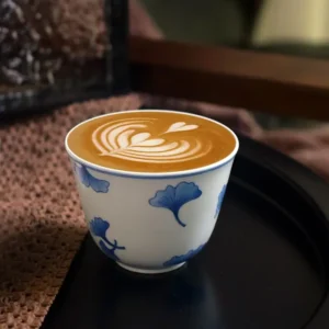Hand-painted blue and white ceramic cup with soft tones, ideal for professors who prefer minimalist style