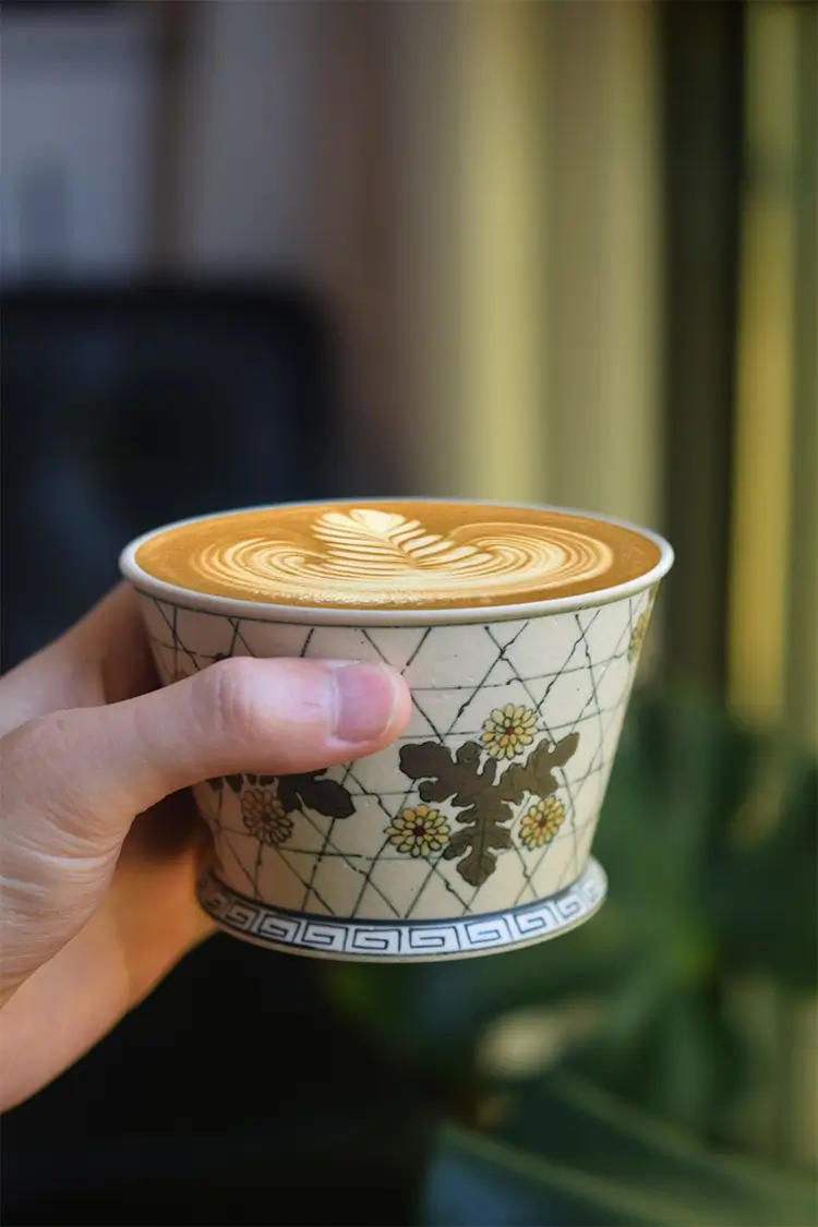 Hand-painted coffee mug features a vintage horseshoe design, perfect for teachers or those who love retro charm.