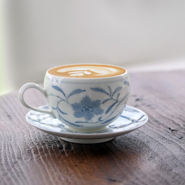 Calm-toned coffee cup set placed on table for mindfulness.