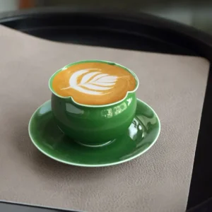 Handcrafted cup and saucer with begonia-shaped rim, perfect for home tea or coffee moments.