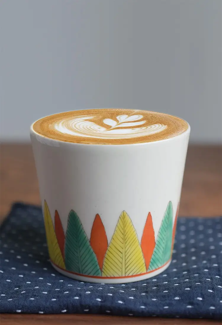Handcrafted ceramic business mug features a personalized design, offering both style and function for office professionals.