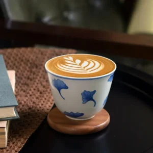 Handcrafted ceramic coffee cup featuring a ginkgo leaf motif, a thoughtful choice for university teachers