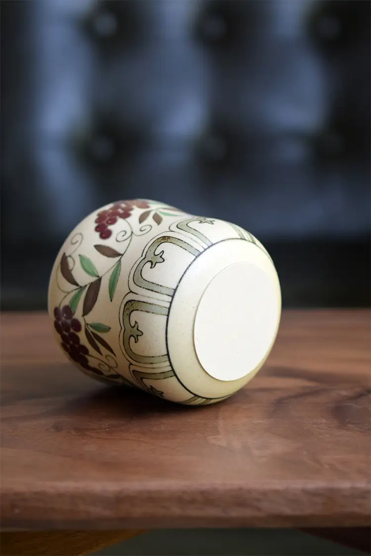 Handcrafted ceramic cup reveals smooth bottom detail, ideal for tea or coffee time.