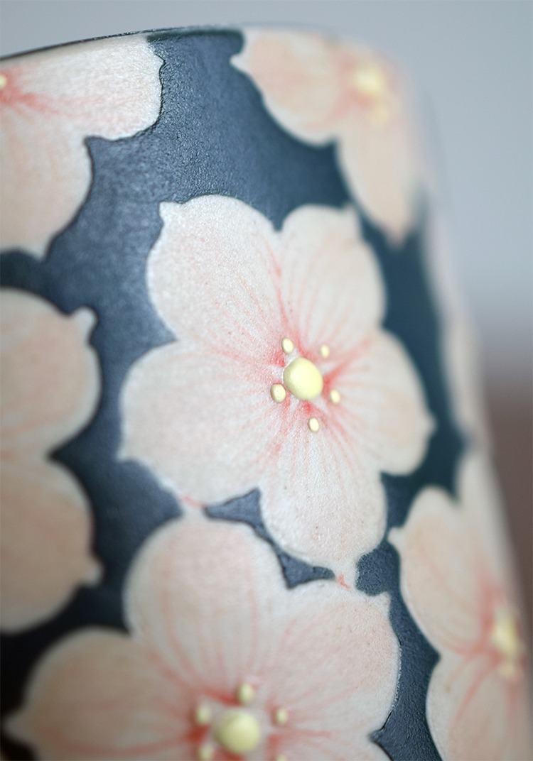 Hand-painted pink cherry blossom detail on Nordic ceramic couple coffee cup.