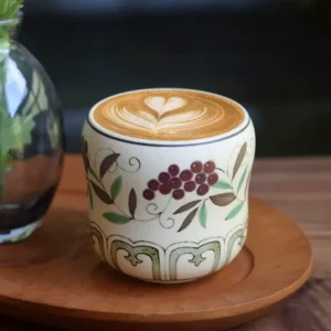 Handcrafted coffee mug features hand-painted grape chanzhi pattern, ideal for morning lattes.