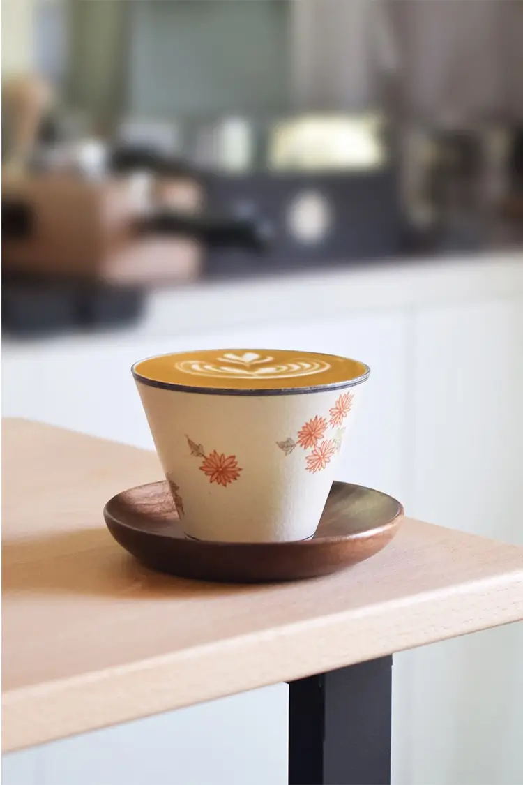 Handcrafted daisy coffee mug combines floral elegance with function, making it the perfect office companion for daily coffee moments.