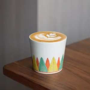 Best handmade ceramic mug featuring hand-painted banana leaves, ideal for office coffee breaks.