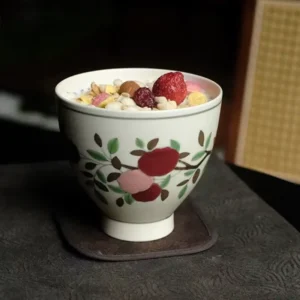 Handmade ceramic cup with underglaze camellia pattern, perfect for enjoying tea or coffee.