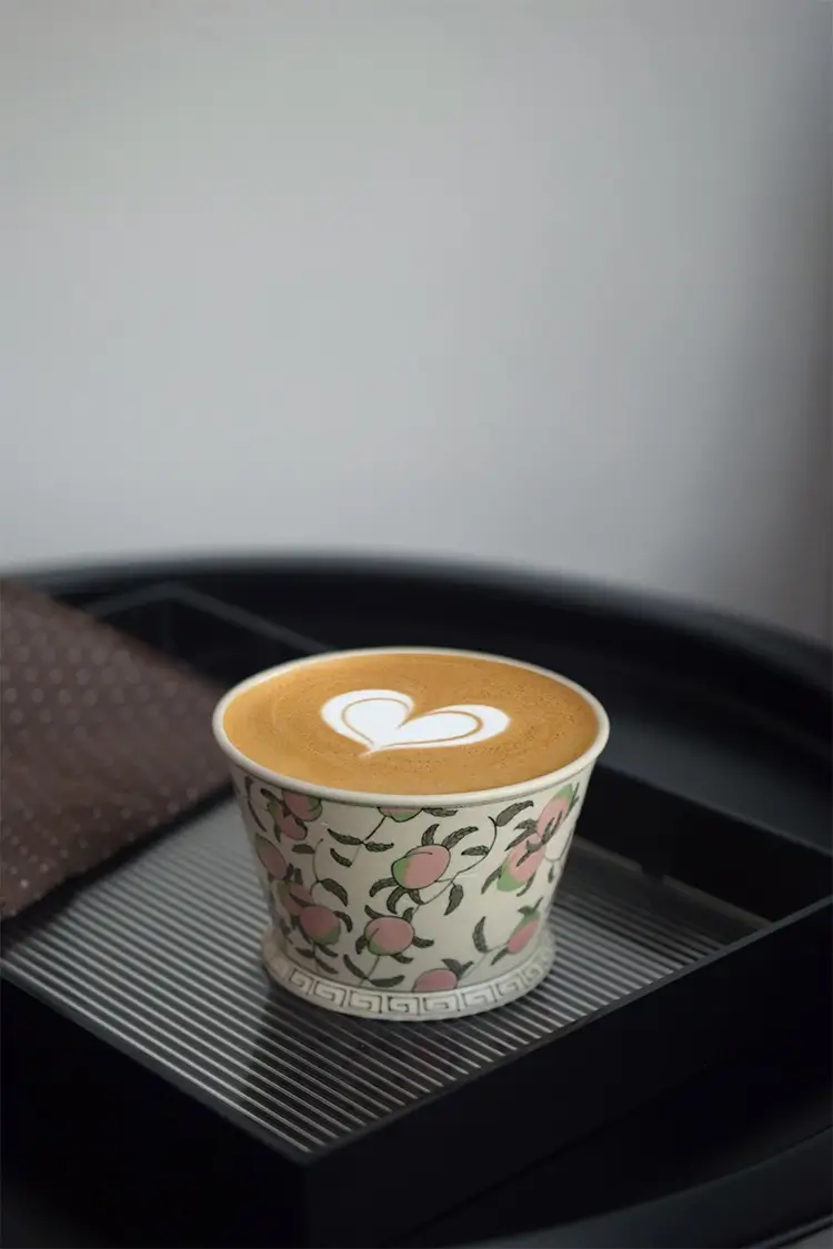 Handmade Cup with hand-painted peach design, perfect for coffee lovers.