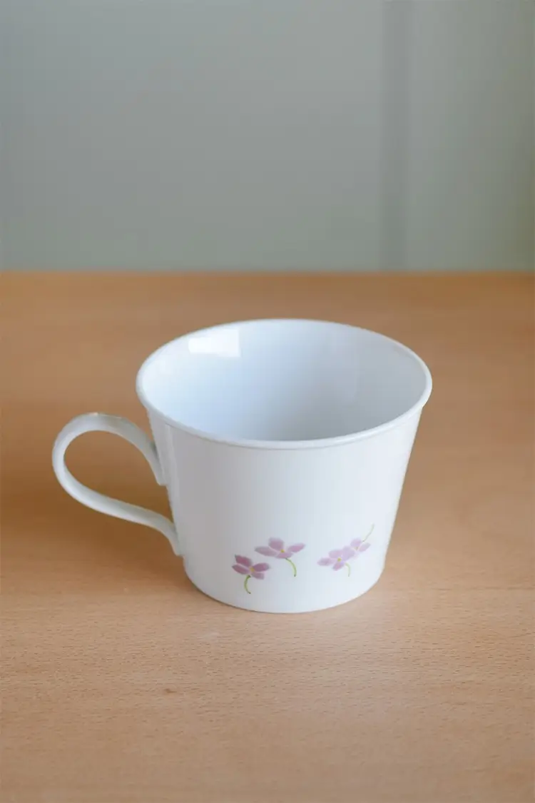 Hydrangea ceramic cup back view, perfect for enjoying coffee or tea.