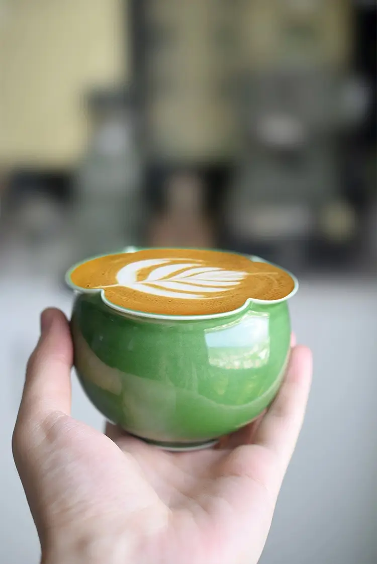 Embrace nature with this jade green ceramic cup, perfect for outdoor camping.