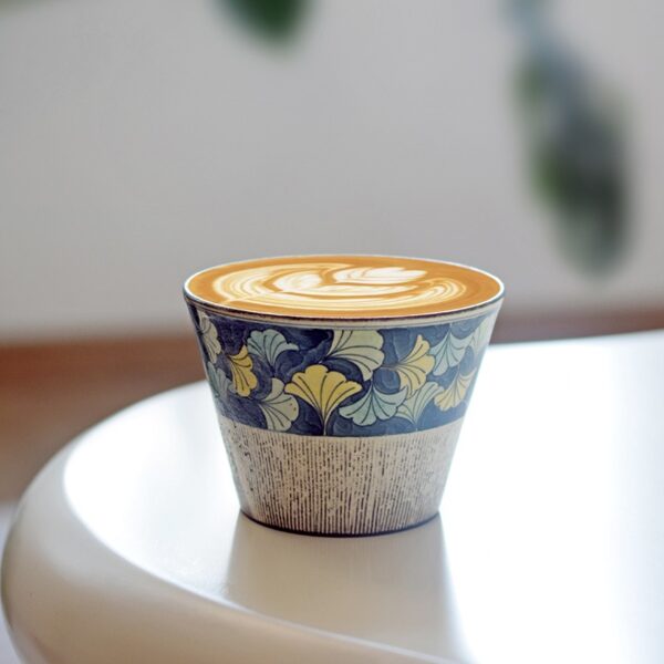 Hand-painted Ginkgo Leaf Ceramic Mug filled with coffee, a vintage coffee cup worth owning.