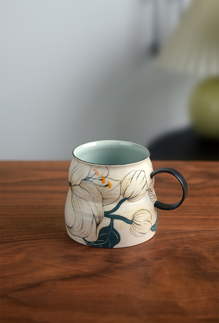 Handmade ceramic mug with gourd shape design, highlighting a creative and individual aesthetic.