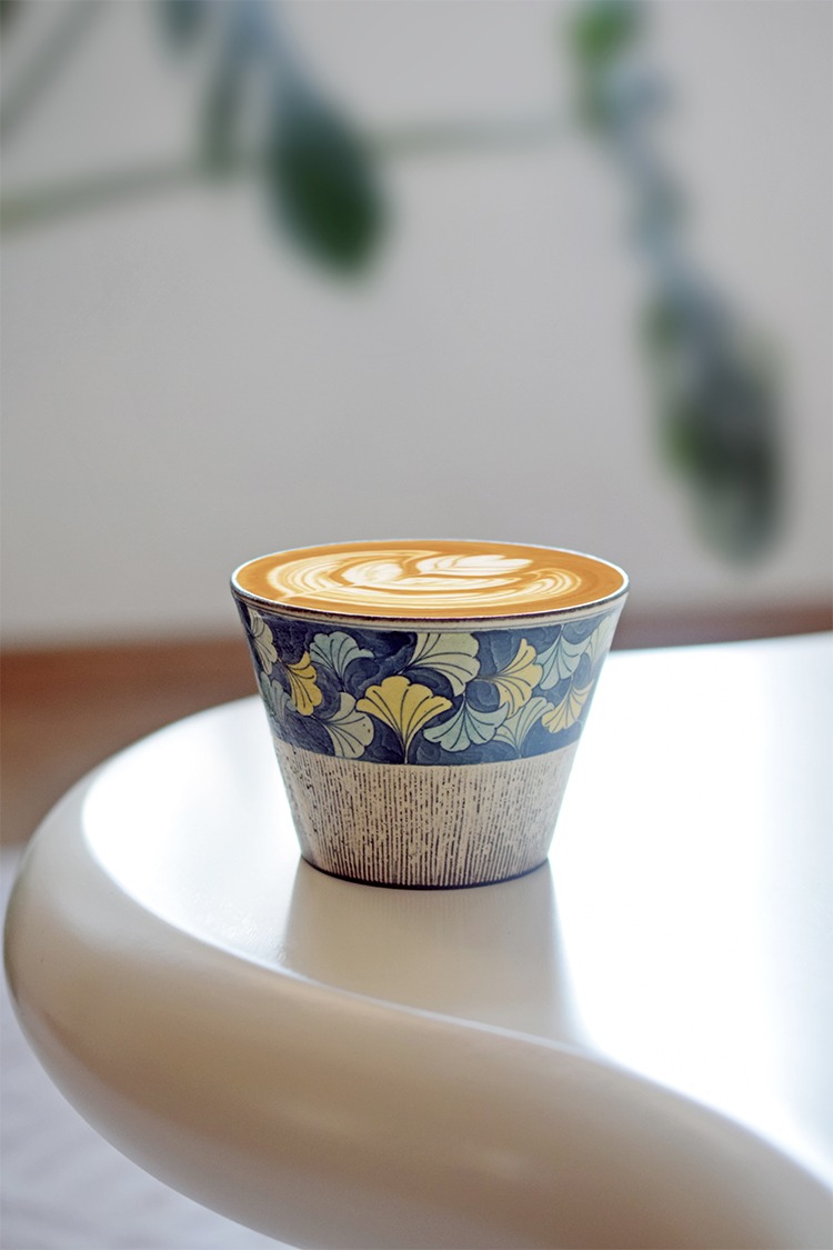 Handmade vintage ceramic mug, perfect for your afternoon coffee break.