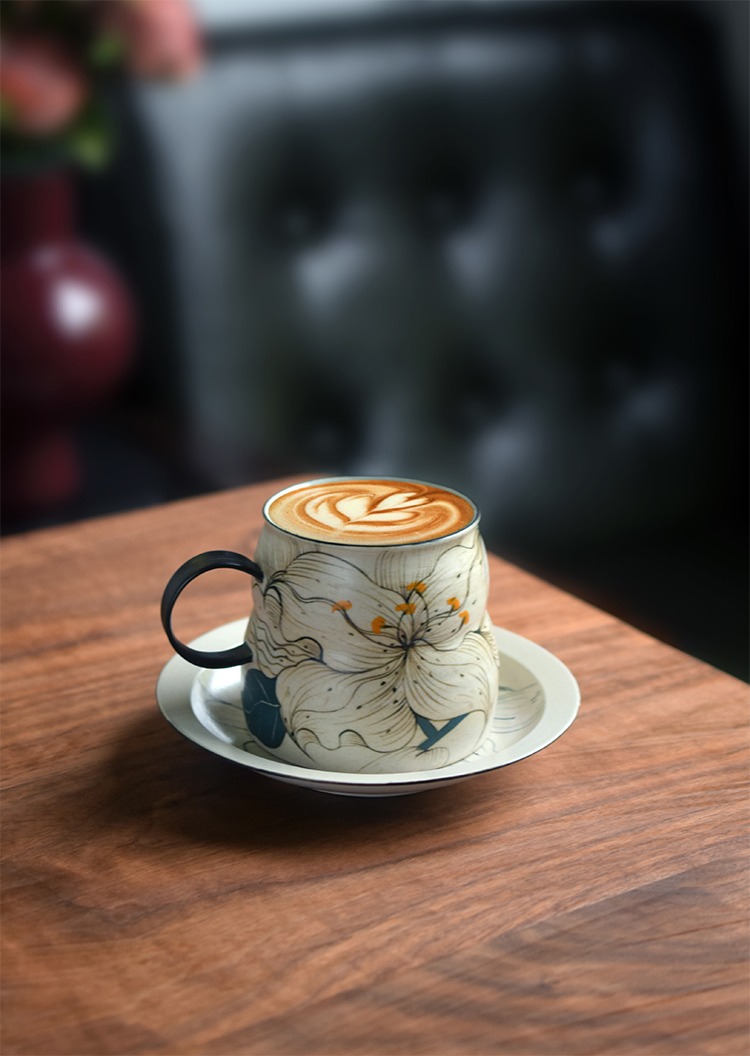 Handcrafted ceramic coffee cup with matching saucer, ideal for daily office use and elegant desk setups.