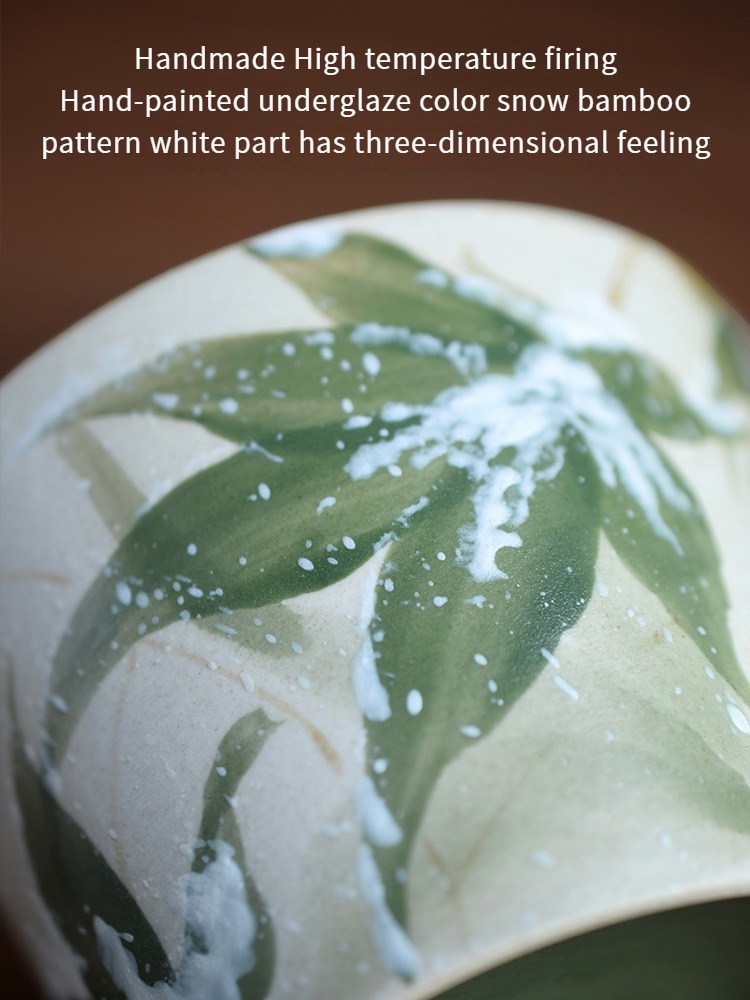 Close-up of snow bamboo ceramic cup with hand-painted raised snow detail in underglaze technique