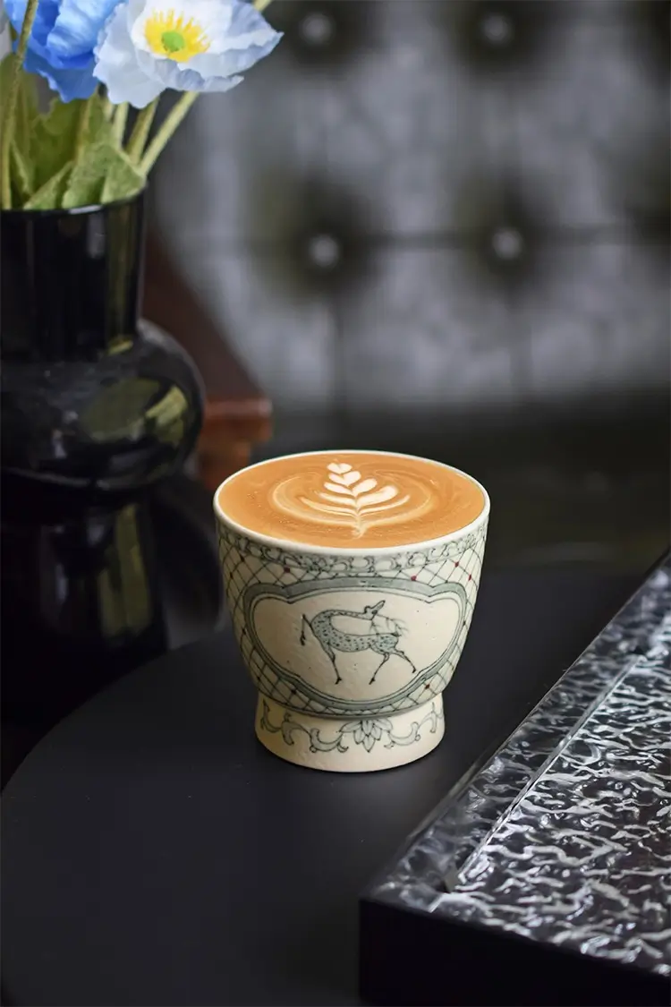 Traditional handmade ceramic cup with blue and white design suits café customization perfectly