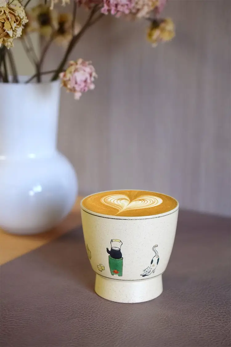 Unique handmade pottery mug uses underglaze technique, making it ideal for enjoying office lattes in style