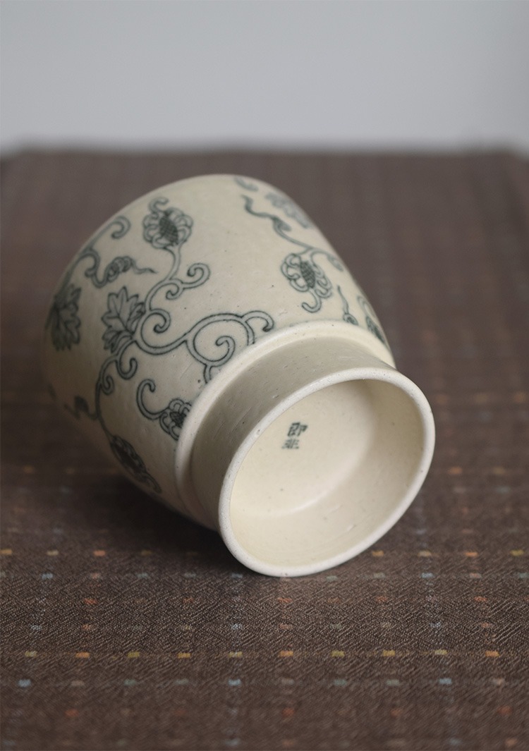 Bottom view of handmade vintage ceramic coffee cup from JIFEI series with embossed stamp detail.