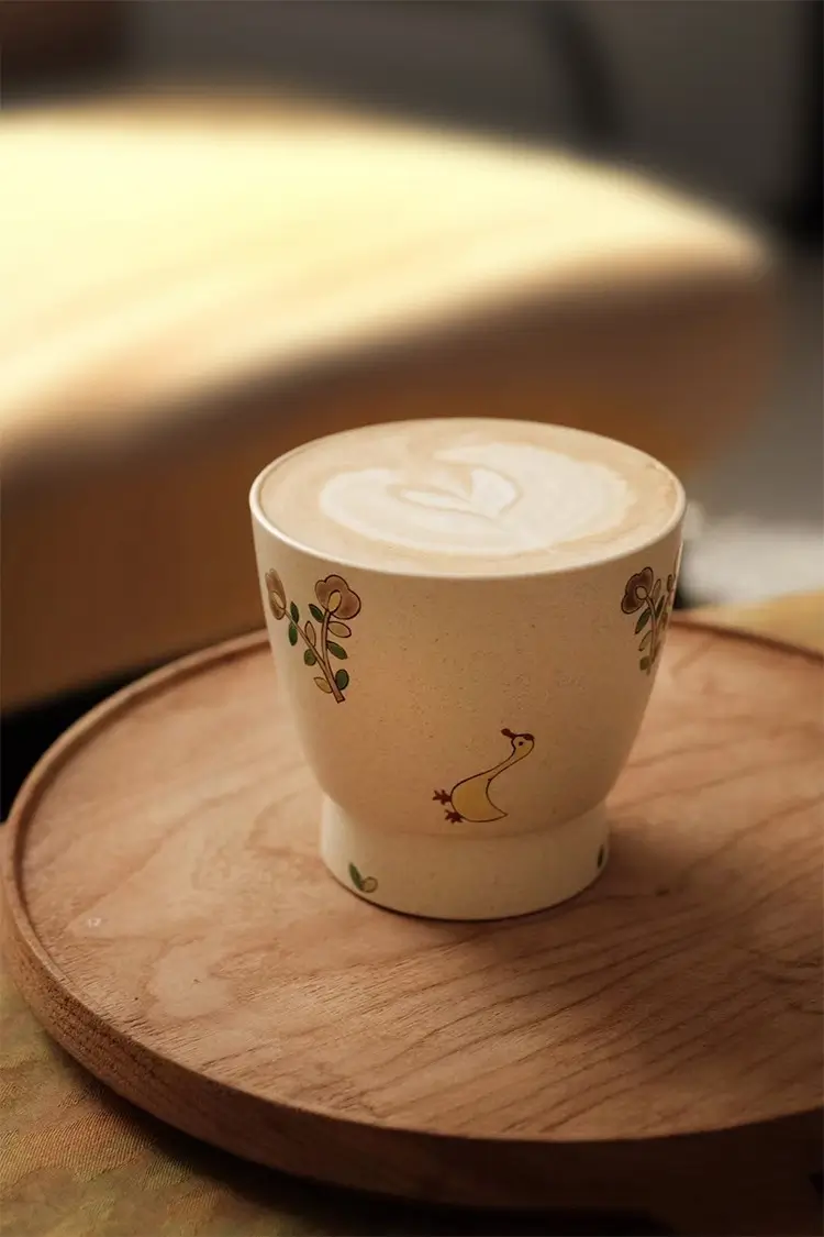 Handmade ceramic coffee mug with vintage style, designed to brighten home life.