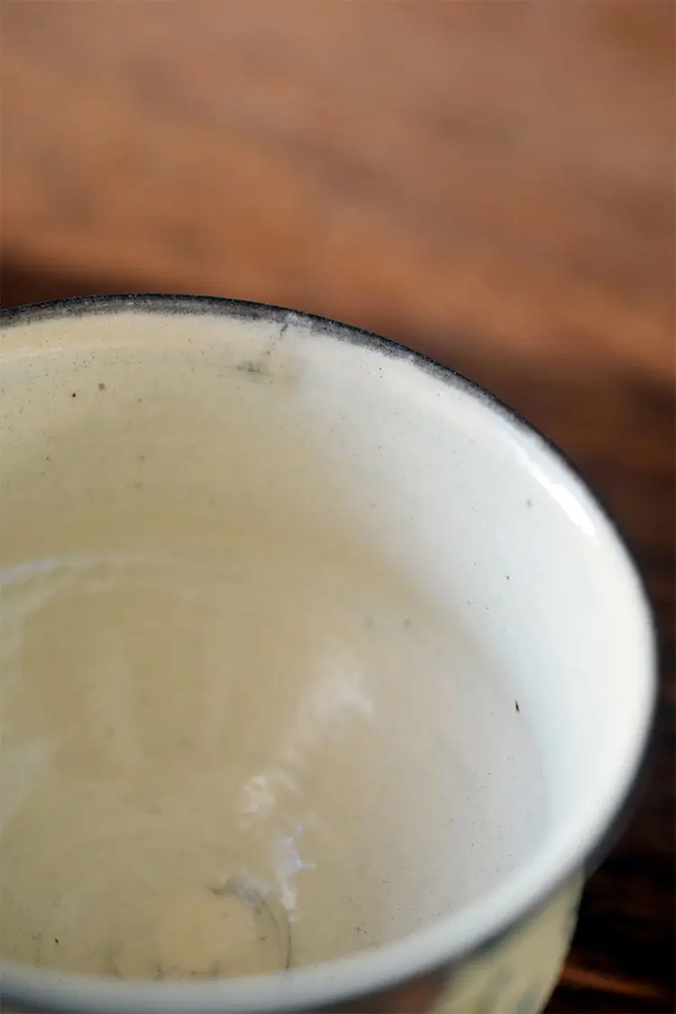 Underglaze ceramic cup with smooth glazed interior, made from aged clay for a nostalgic aesthetic.