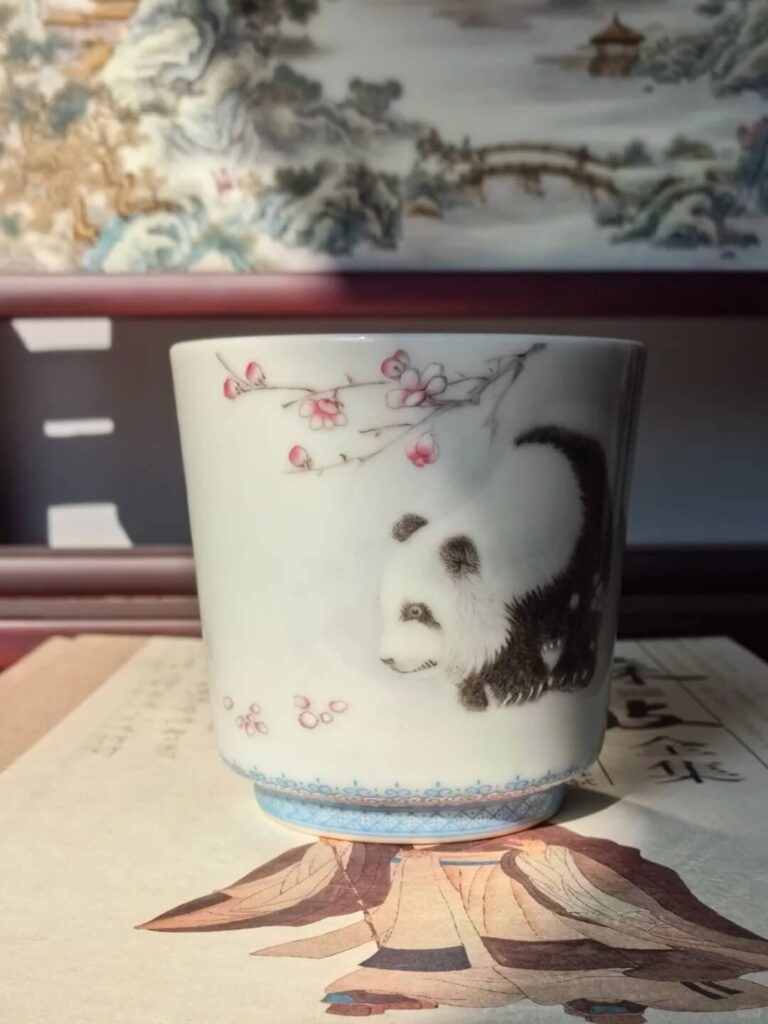 Hand-painted panda motif porcelain tea cup with bamboo accents, Xiaogu Tang's contemporary animal series