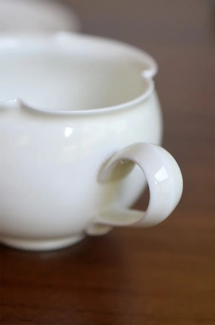 Ceramic mug with handle, designed for convenience and everyday use, offering comfort and functionality.