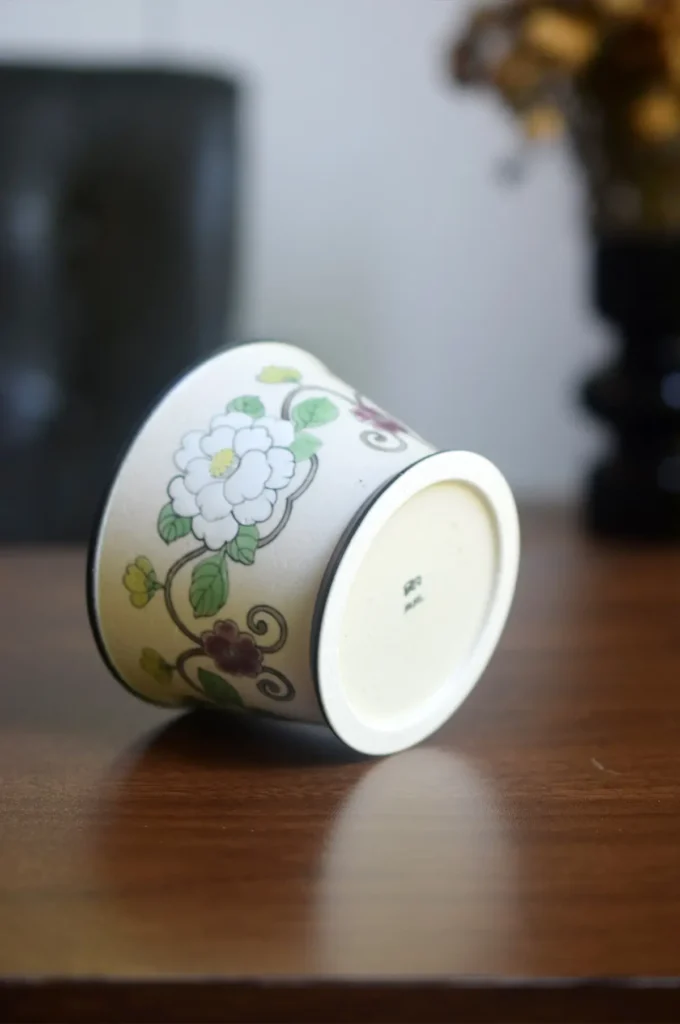 Hand-painted ceramic coffee mug highlights the JIFEI seal at the base, showcasing artisan authenticity.