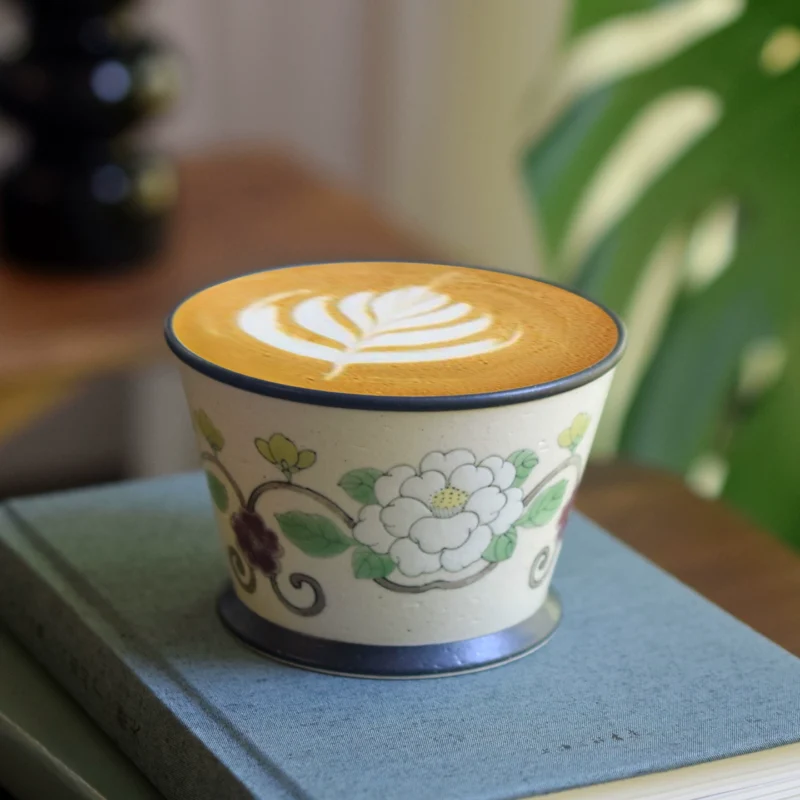 Hand-painted white camellia ceramic mug combines Chinese elegance with modern everyday usability.