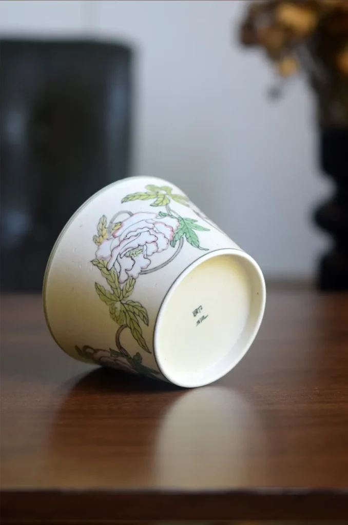 Handmade ceramic coffee mug from the JIFEI Series showcases a unique base stamp for artisan authenticity.