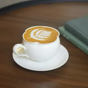 Solid color ceramic cup and saucer in minimalist handmade style for daily latte.