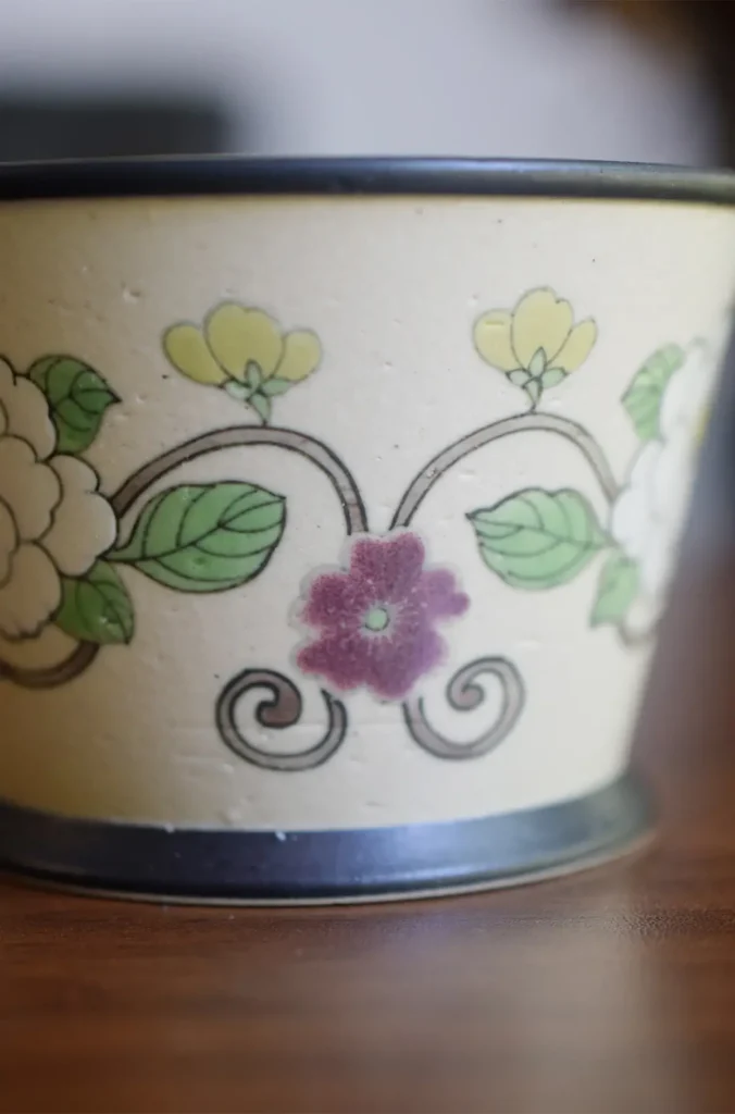 Vintage ceramic floral coffee cup showcases hand-painted details crafted with traditional techniques.