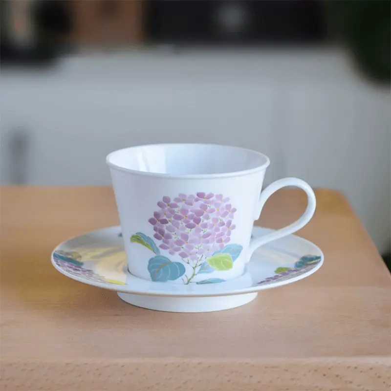 Hand-painted ceramic coffee mug and saucer set with underglaze purple hydrangea, perfect for coffee lovers’ handcrafted tableware.