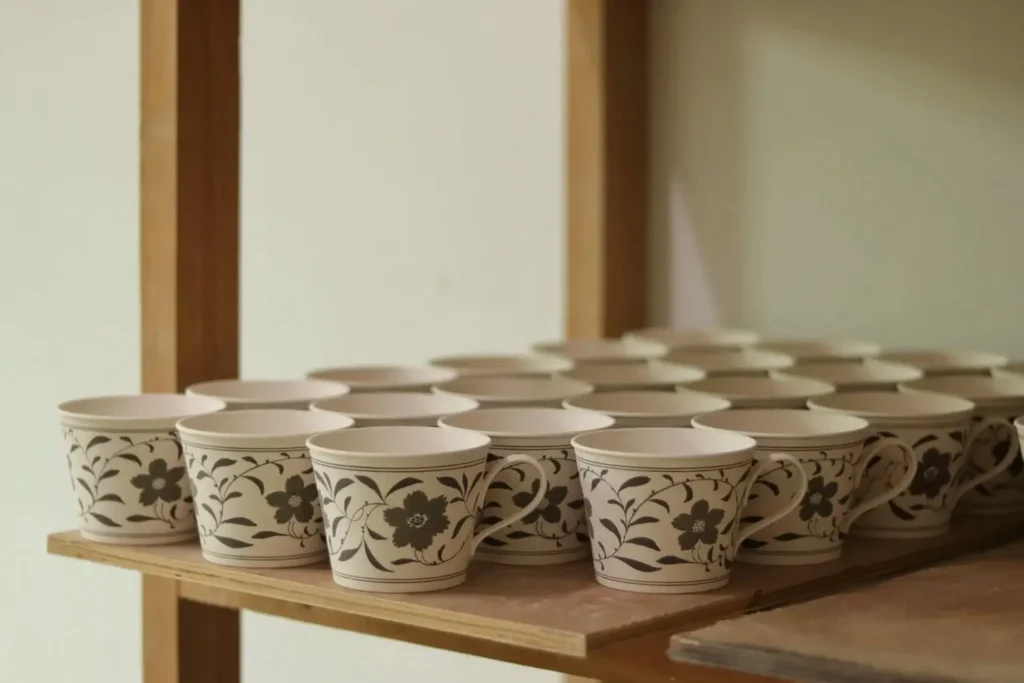 Blue and White Ceramic Mugs with hand-painted vine motif in traditional underglaze style