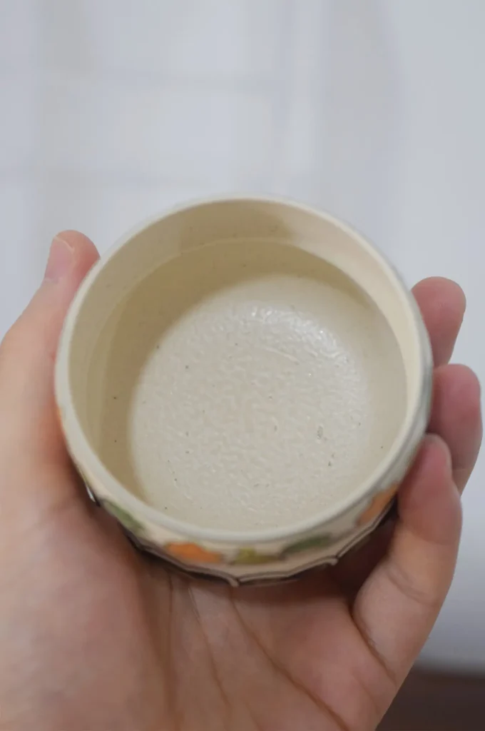 Handmade ceramic tea ceremony cup showing detailed interior craftsmanship.