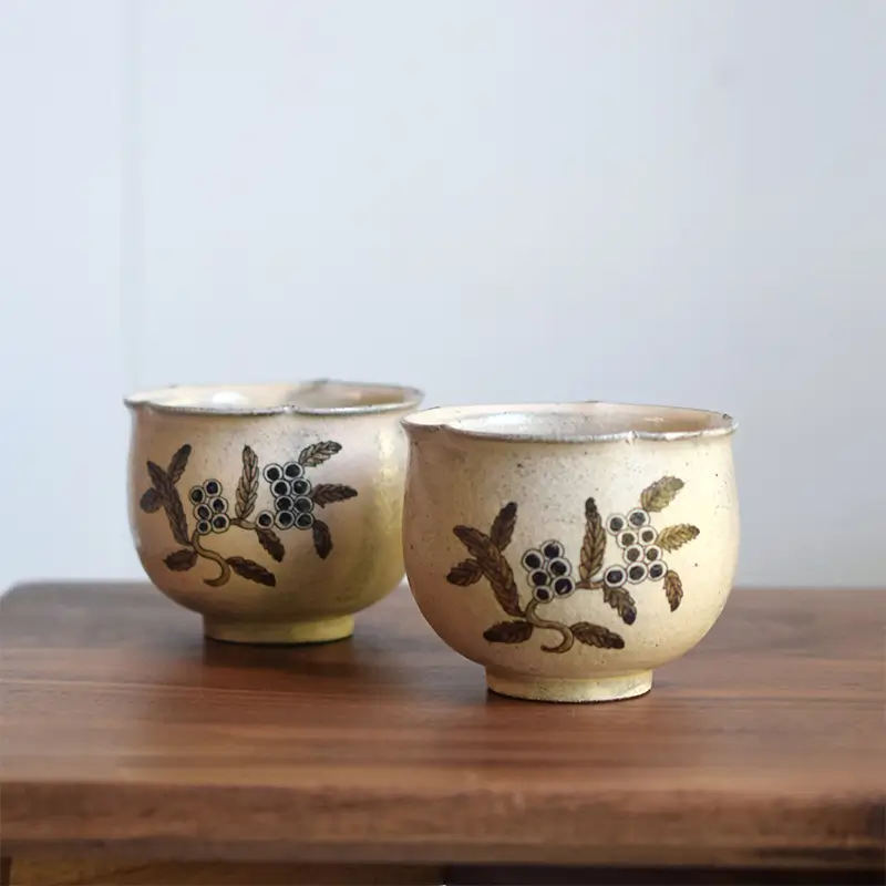 Handmade custom ceramic cup with underglaze hand-painted design, perfect for traditional tea sets and tea enthusiasts.
