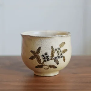 Handmade Japanese ceramic cup made with coarse clay, showcasing traditional craftsmanship and a vintage style for everyday use.